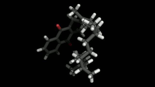 Vitamin K molecule stick representation on black background
