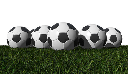 soccer balls on a green grass