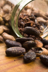 Cocoa (cacao) beans on natural wooden table