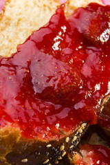 Obraz premium Sweet bread ( challah ) with strawberry jam