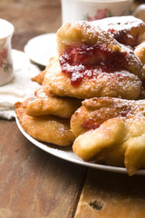 Dough with marmelade on wooden board