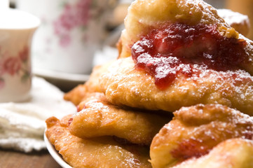 Dough with marmelade on wooden board