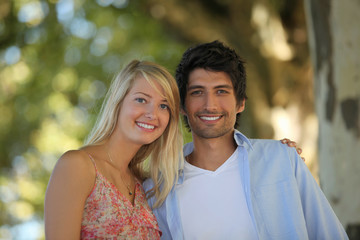Obraz premium Happy couple having a walk in the woods