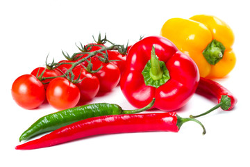 Peppers, chili and tomatoes isolated on white