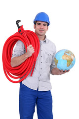 plumber holding globe with hose over his shoulder