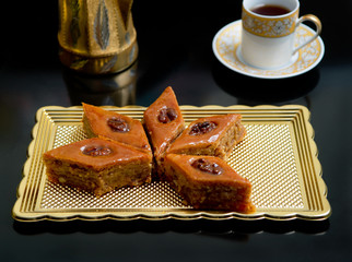 Arabian and Turkish sweets baklava, oriental dessert food and coffee