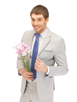 Handsome Man With Flowers In Hand