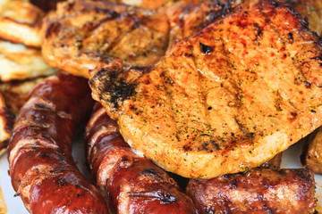 Grilled sausages and meat