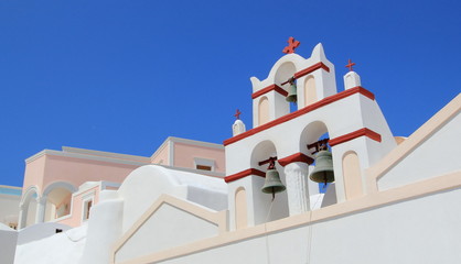 Fototapeta na wymiar Belfry of a typical greek church, Oia, Santorini, Greece