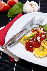 Tortellini with ingredients in the background