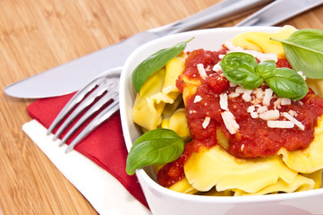 Fresh Tortellini in a bowl on wooden background