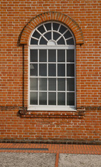 White painted wood arched window
