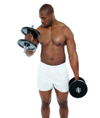 Fototapeta na wymiar Young african man doing biceps exercise