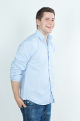 Fototapeta premium portrait of a young happy man in blue jeans and shirt