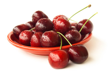 Cherries on a red plate