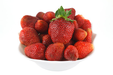 Fresh strawberries on a white plate
