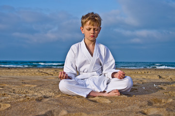 Naklejka na ściany i meble Karate boy meditates