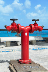 Fire hydrant on the beach. Hulhule Island, Male, Maldives.