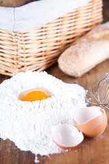 still life of bread, flour, eggs