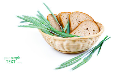 tasty baked bread with ears of wheat, isolated on a white backgr