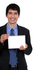 Businessman holding notepad