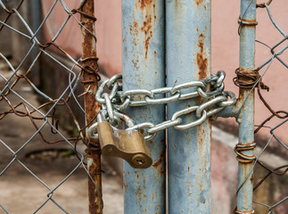 padlock and metal gate