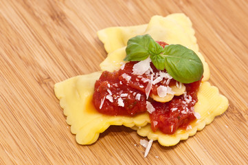 Some Raviolis with tomato sauce