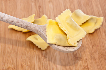Some Raviolis on wooden background