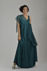 Fototapeta premium elegant woman in fashionable dress posing in the studio