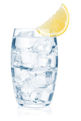 Glass of pure water with ice cubes and lemon slice