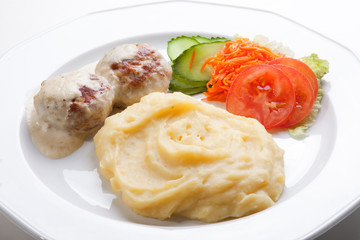 meat cutlet with mashed potatoes and fresh salad
