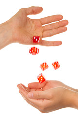 Five red dice being thrown from a hand