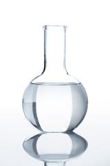 Laboratory flask with a transparent liquid, isolated