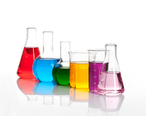 Various glass flasks with a colored liqiuds