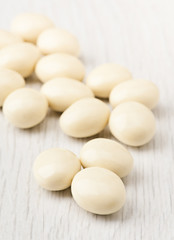 Fototapeta na wymiar white chocolate balls with almond heart