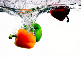 Three Peppers Splashed into Water