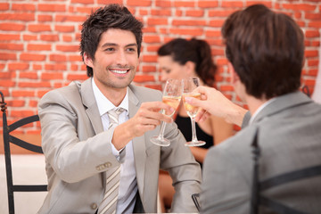 Friends having a celebratory drink