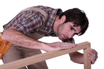 Joiner checking his work