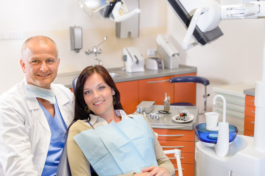 Dentist and female patient at surgery office