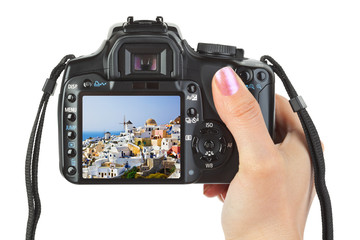 Camera in hand and Santorini (Greece) view