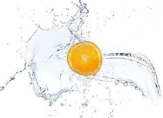 Fototapeta na wymiar Orange slice falling and splashing into clear water.