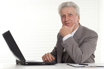mature man sitting at the computer