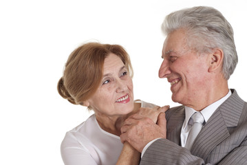 An elderly man with a lady standing