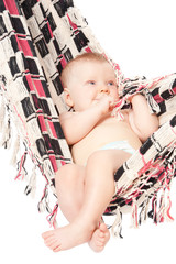 baby in hammock on white background