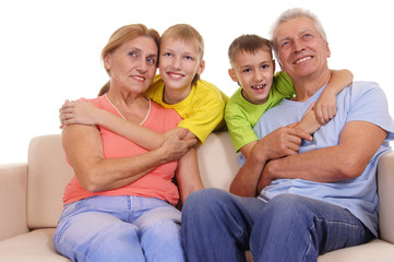 grandparents and grandsons on white
