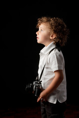 Fototapeta na wymiar young child holding a camera