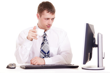 businessman in a shirt sitting at a computer