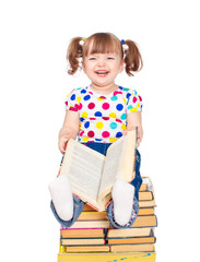 little girl sitting on the books