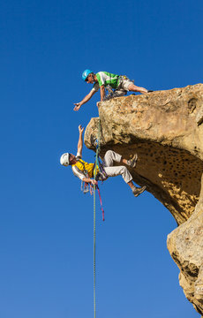 Climbing team struggles to the summit.