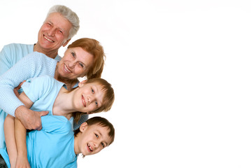 Fototapeta na wymiar Happy love grandparents with grandchildren fooled